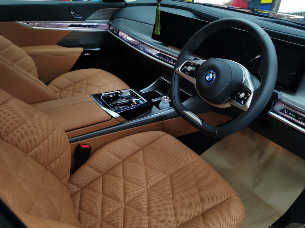 The BMW i7 parked in the workshop, freshly coated.