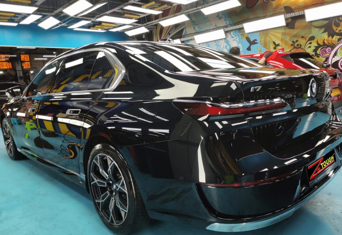 Rear quarter of the BMW i7, glossy and protected.