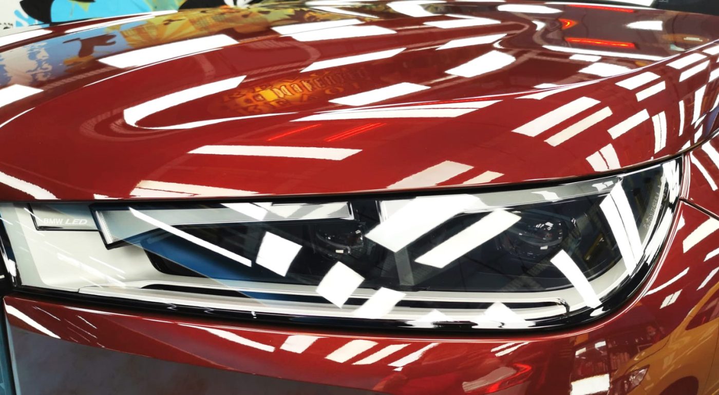 The iX's coated paintwork showing clean reflections.