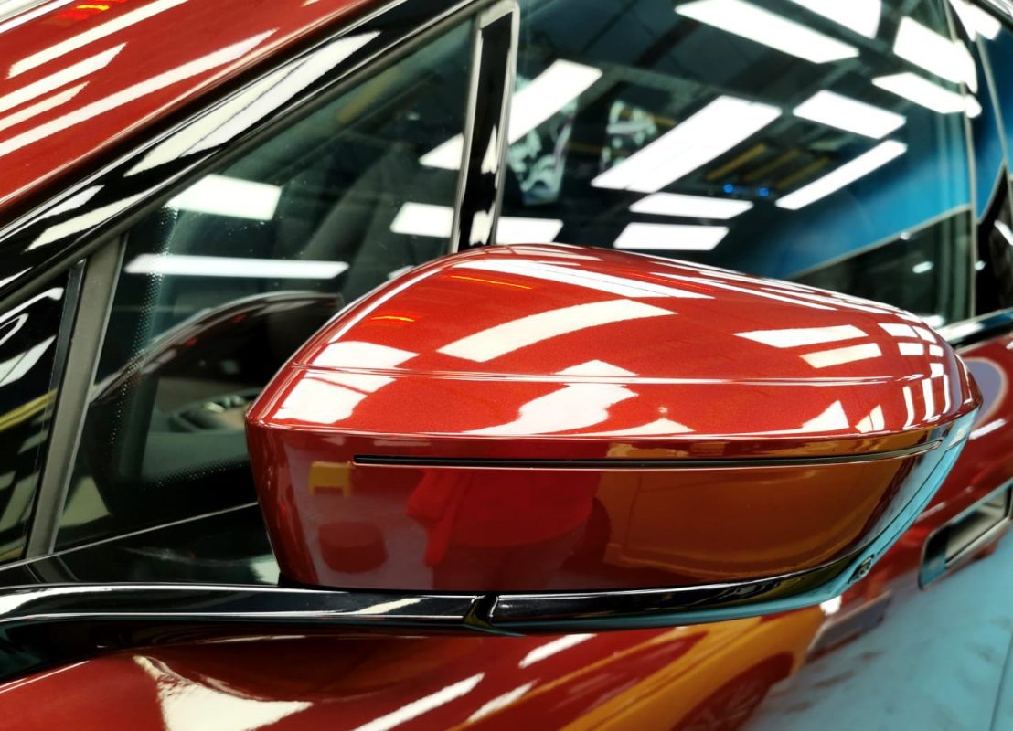 The BMW iX parked in the workshop, freshly coated.