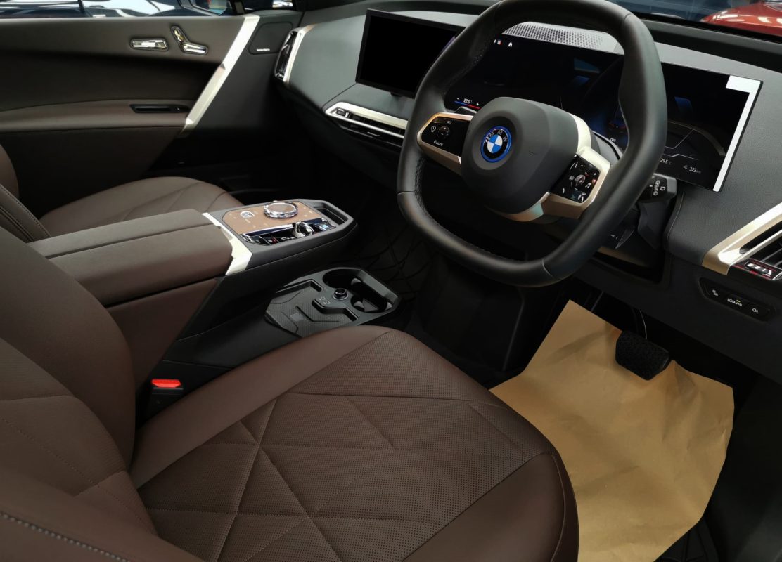 Side panel of the BMW iX with the titanium finish locked in.