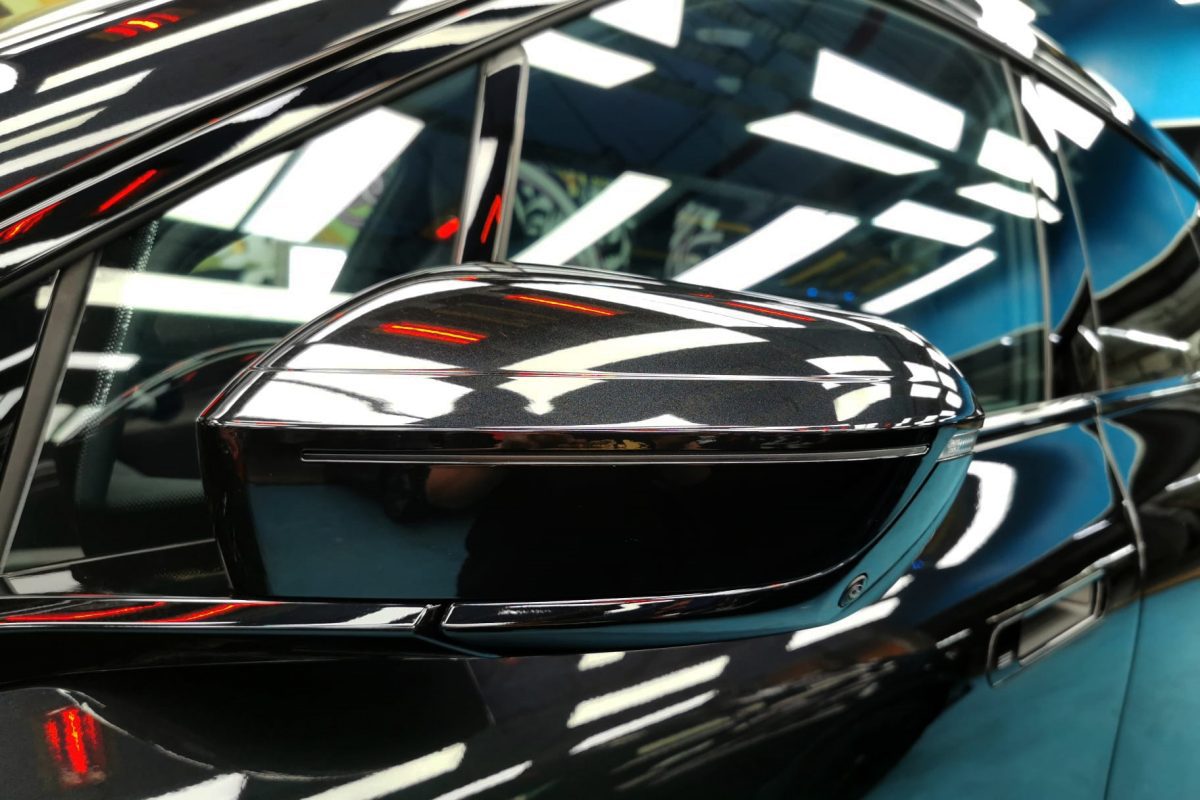 Rear quarter of the BMW iX, glossy and protected.