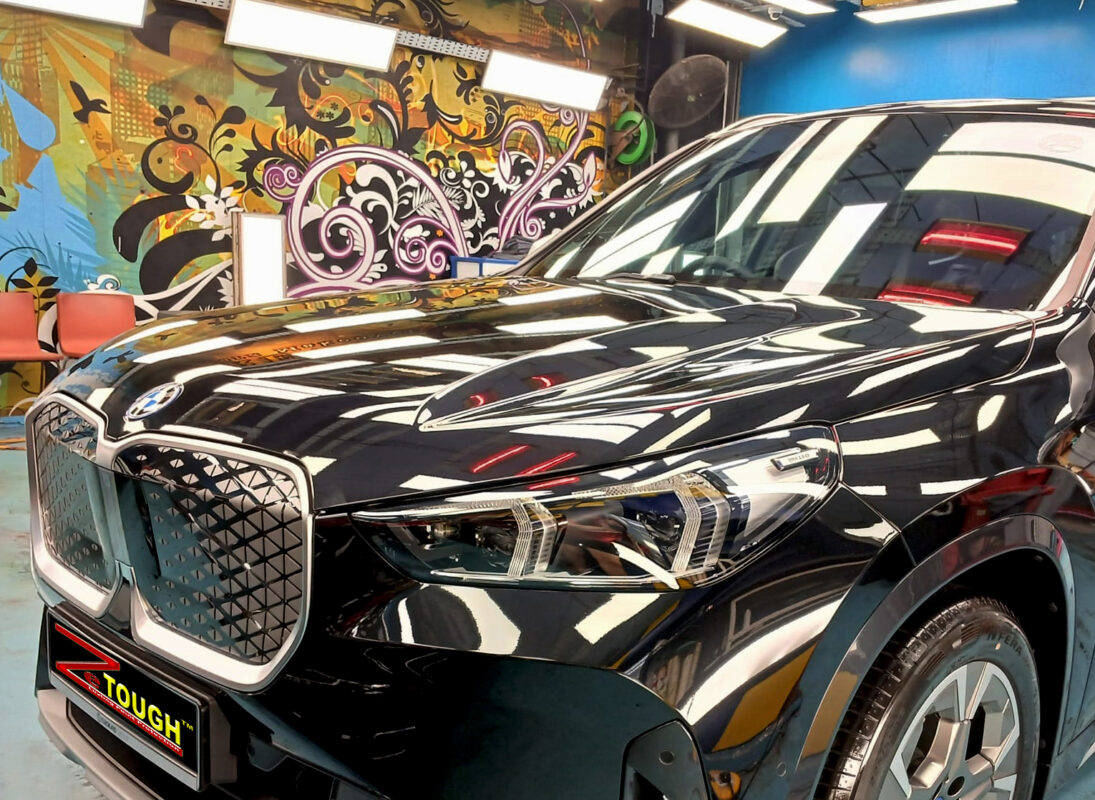 The BMW iX1 from a side angle after the titanium coating.
