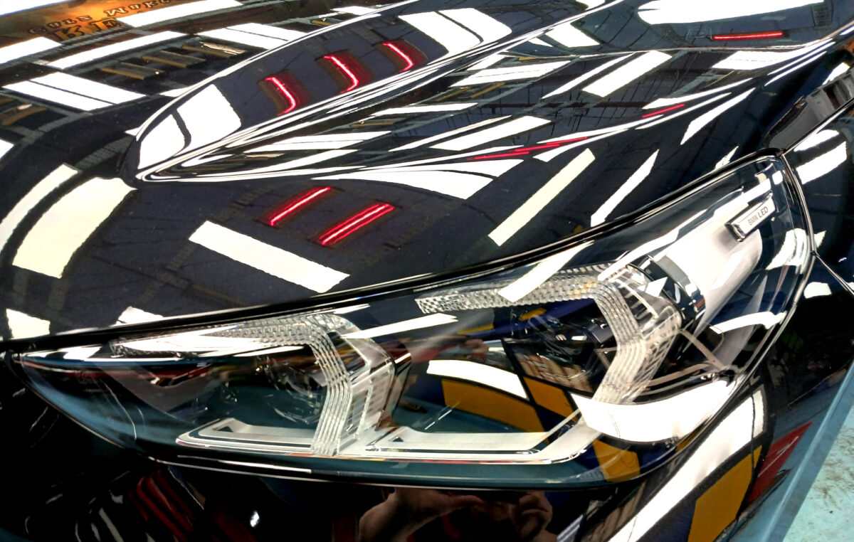 The iX1's coated paintwork showing clean reflections.