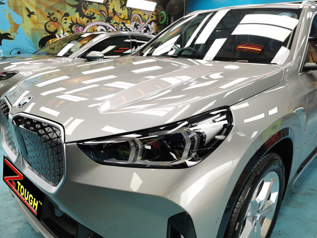 The BMW iX1 from a side angle after the ceramic coating.