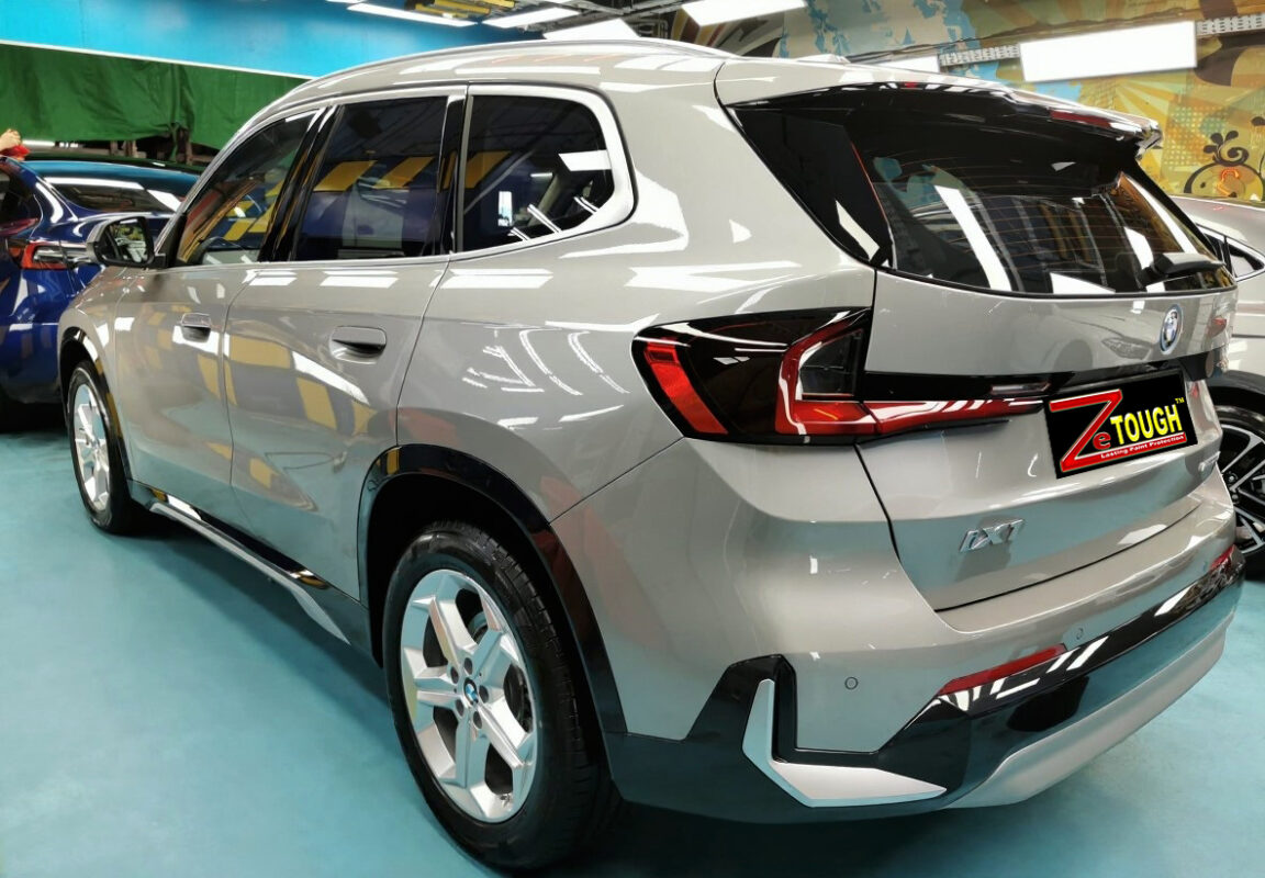 Rear quarter of the BMW iX1, glossy and protected.