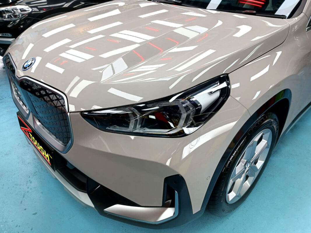 The BMW iX1 from a side angle after the ceramic coating.