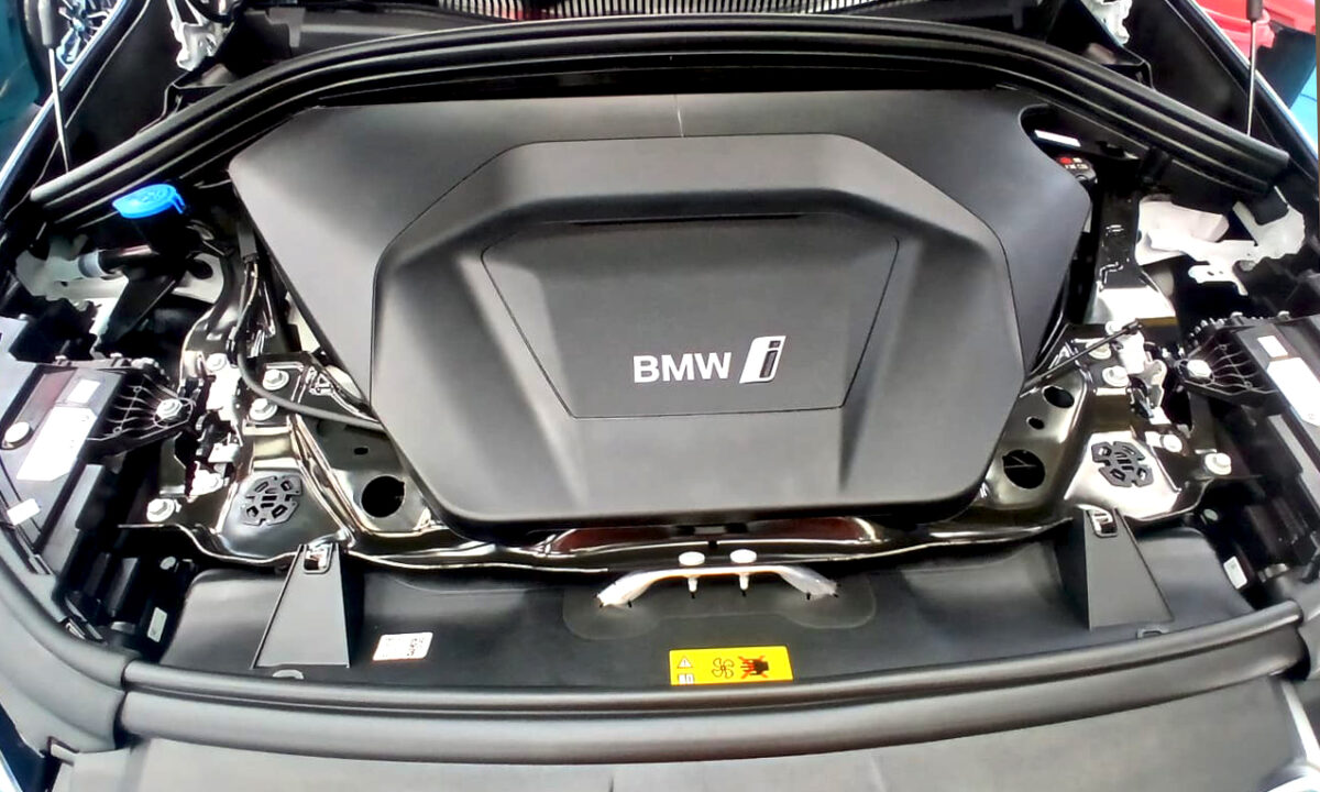 Reflections across the coated panels of the BMW iX1.