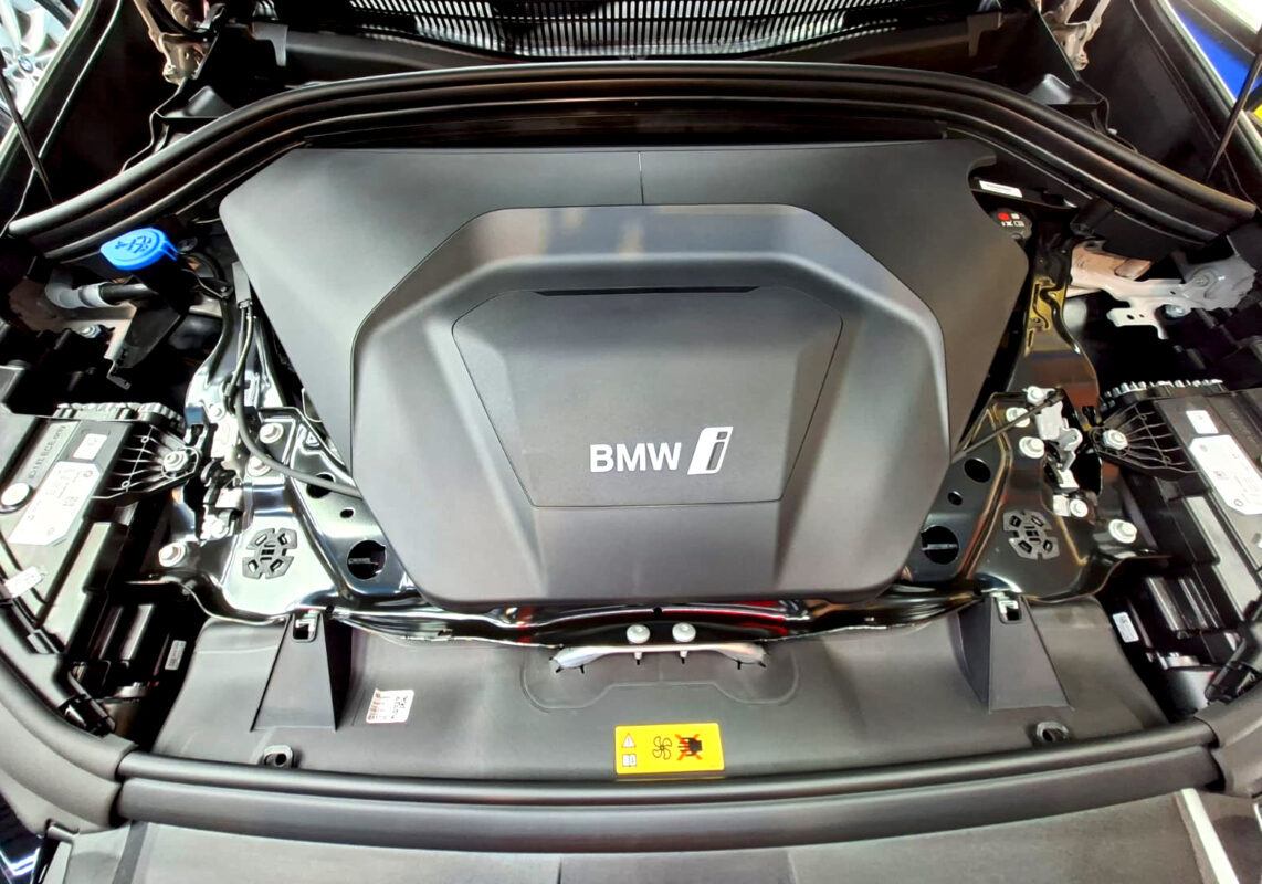 Reflections across the coated panels of the BMW iX1.