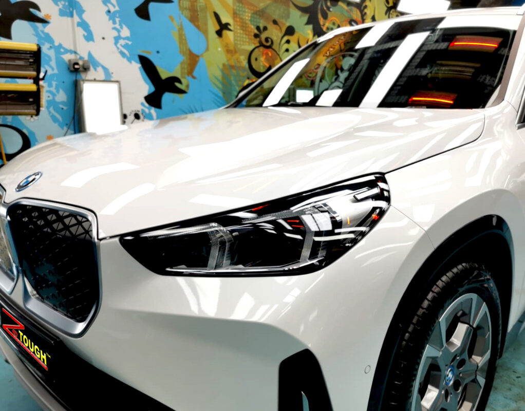 The BMW iX1 from a side angle after the ceramic coating.