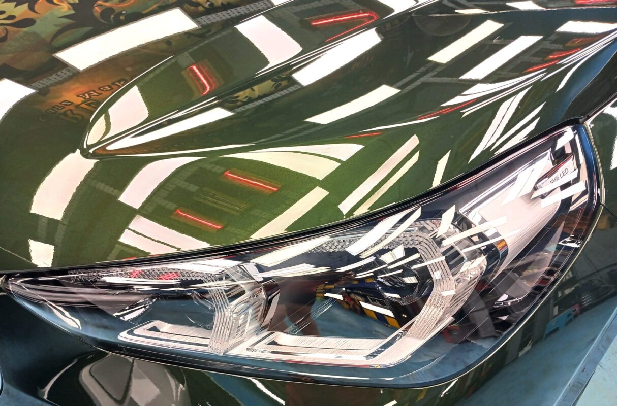 The iX1's coated paintwork showing clean reflections.
