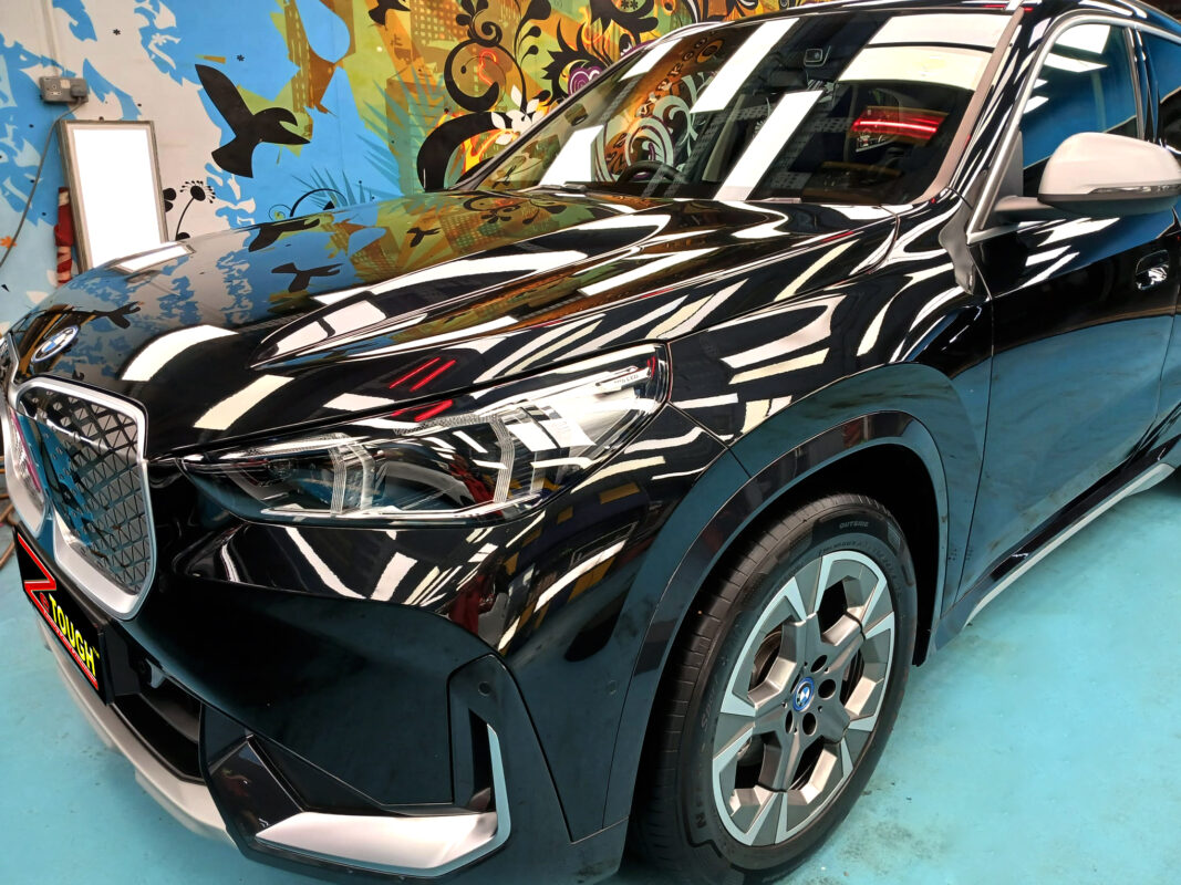 The BMW iX1 from a side angle after the ceramic coating.