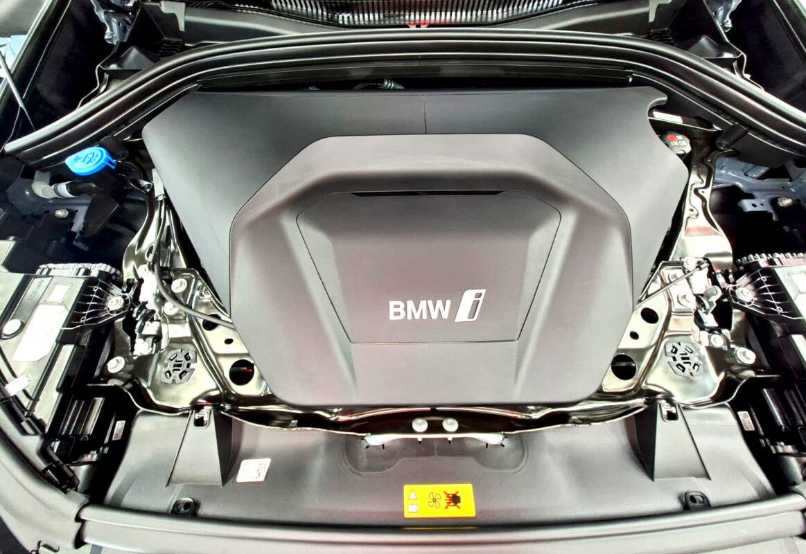 Reflections across the coated panels of the BMW iX1.