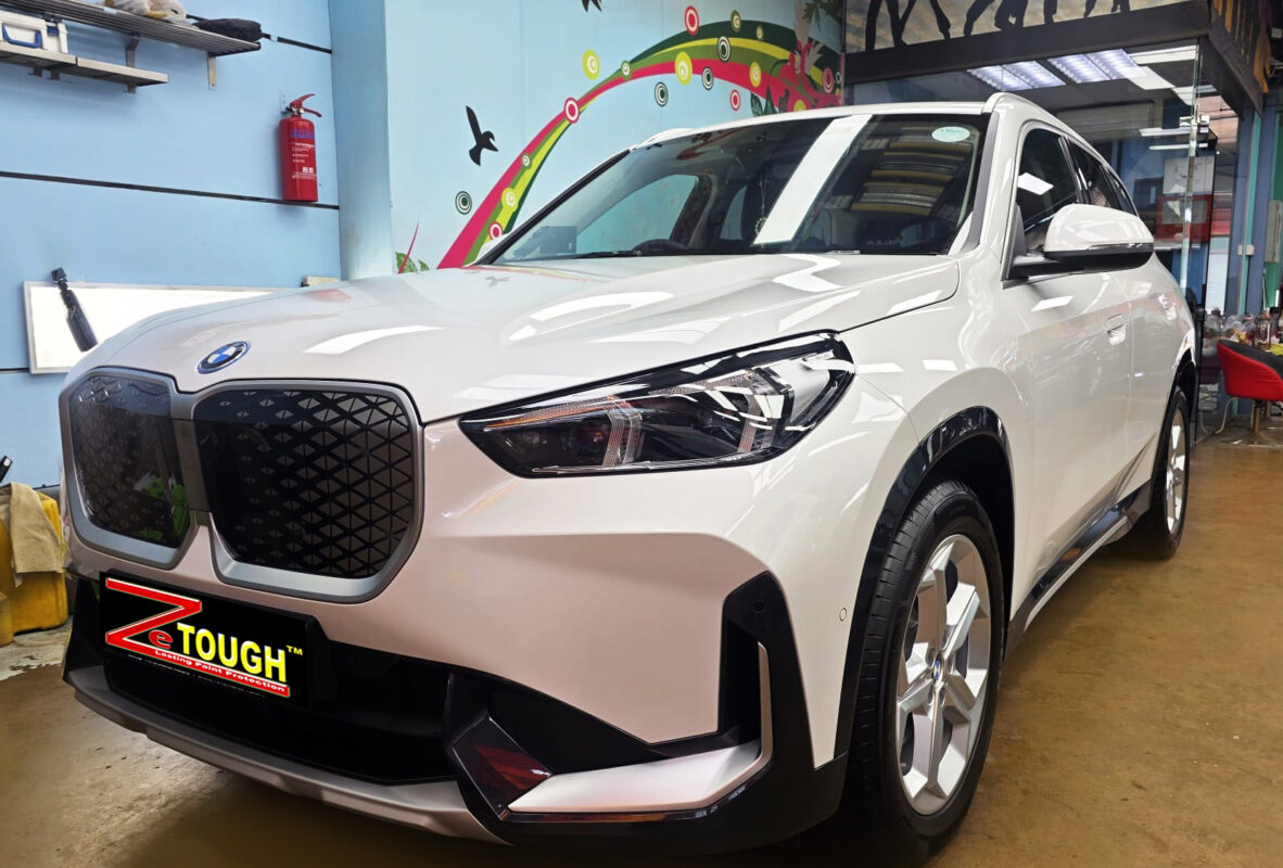 BMW iX1, glossy after its ZeTough Titanium coating.