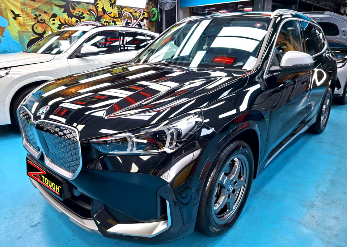 BMW iX1, glossy after its ZeTough Titanium coating.