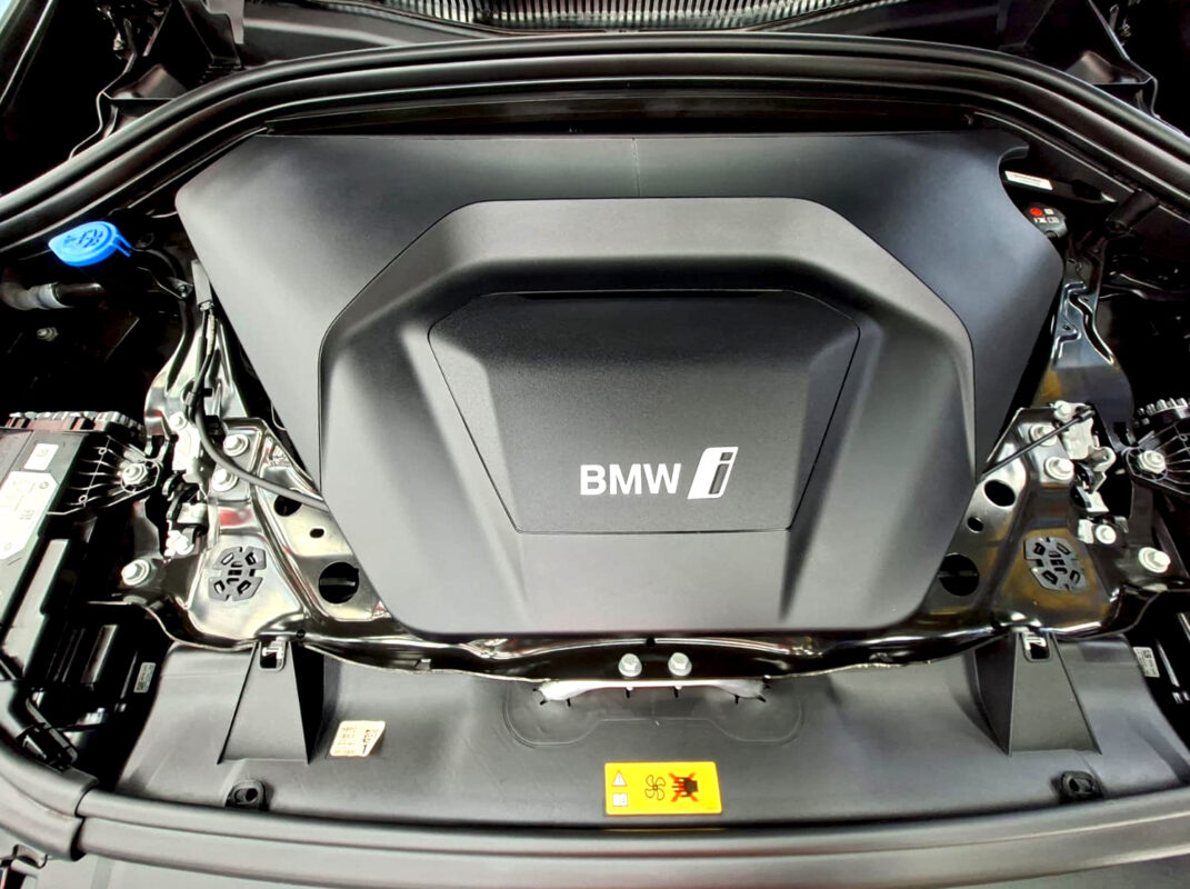 Reflections across the coated panels of the BMW iX1.