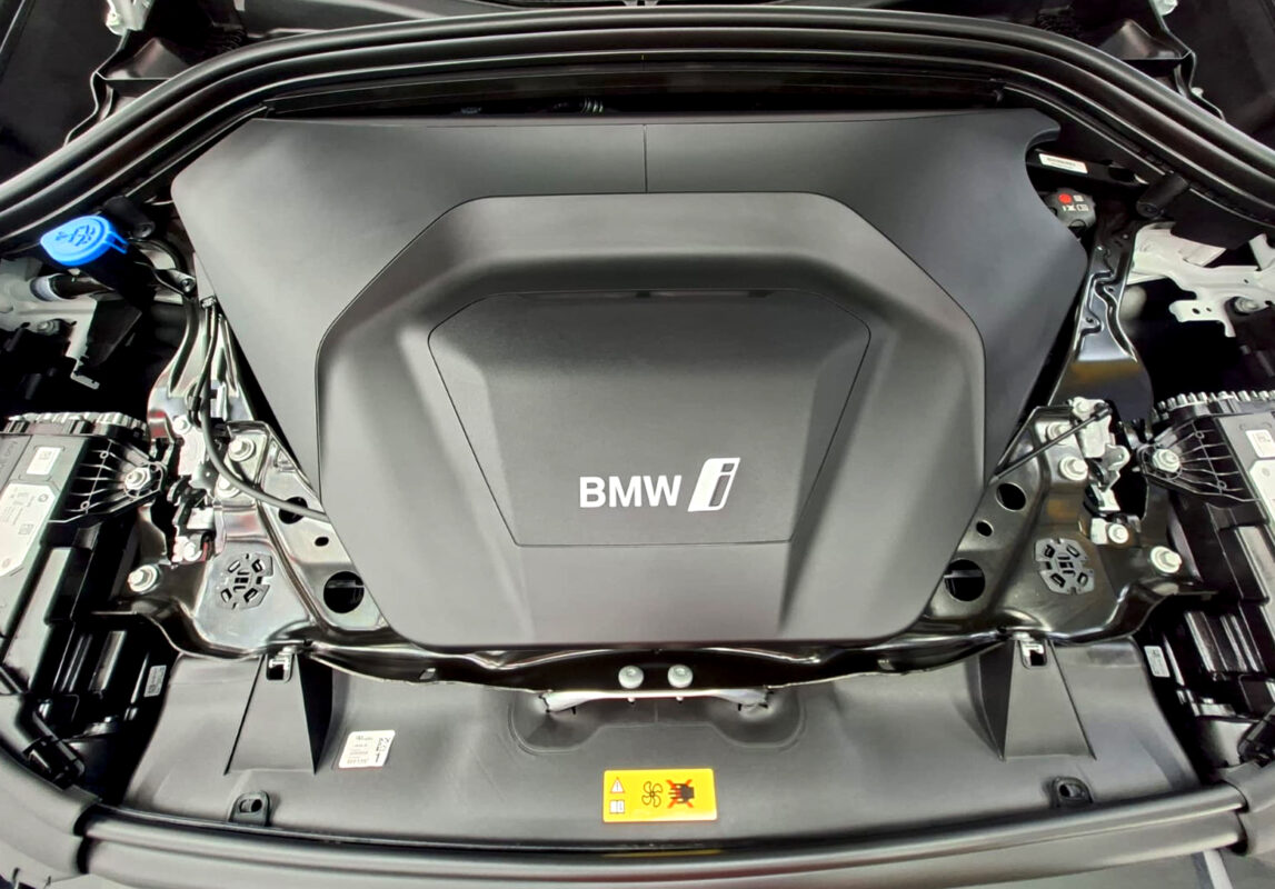 Reflections across the coated panels of the BMW iX1.