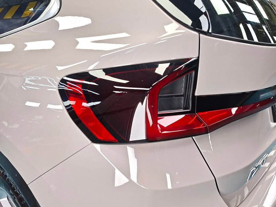 Close-up of the BMW iX1 tail lamp and rear quarter.