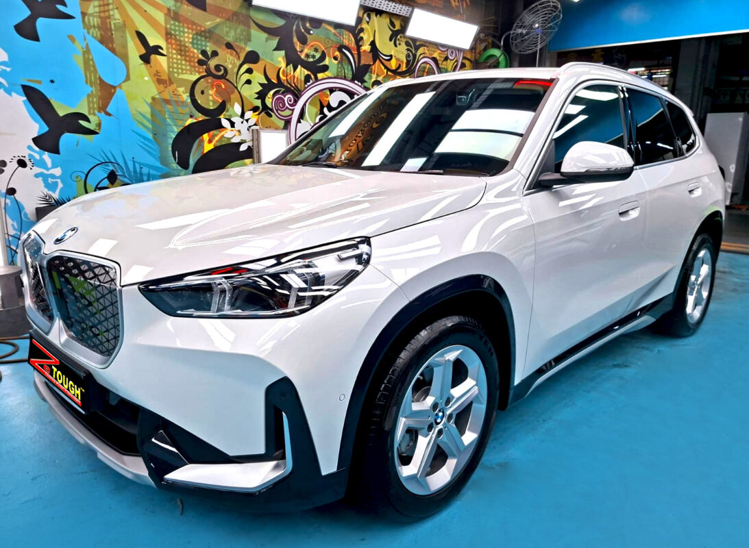 BMW iX1, glossy after its ZeTough Titanium coating.