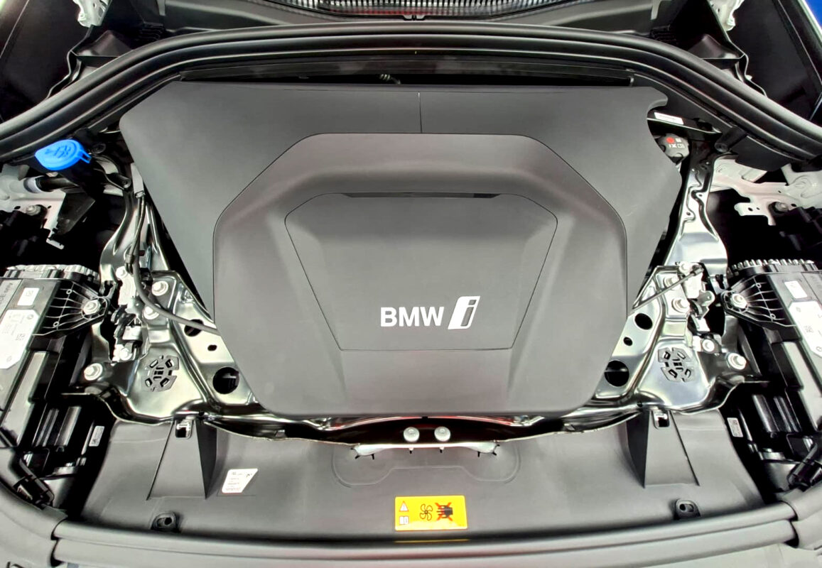 Reflections across the coated panels of the BMW iX1.