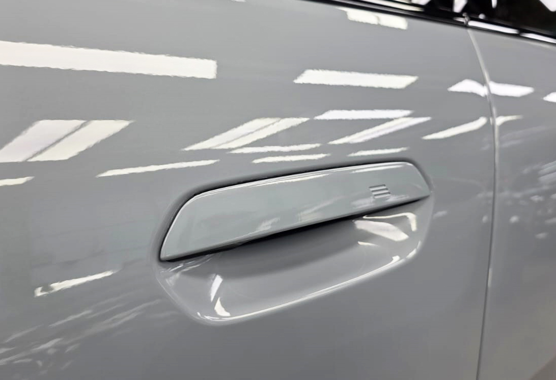 Front three-quarter view of the BMW iX2 after coating.