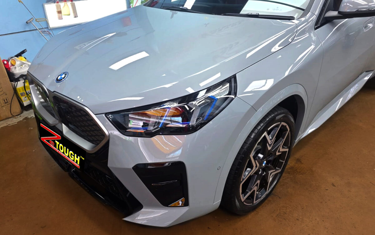 The BMW iX2 from a side angle after the titanium coating.