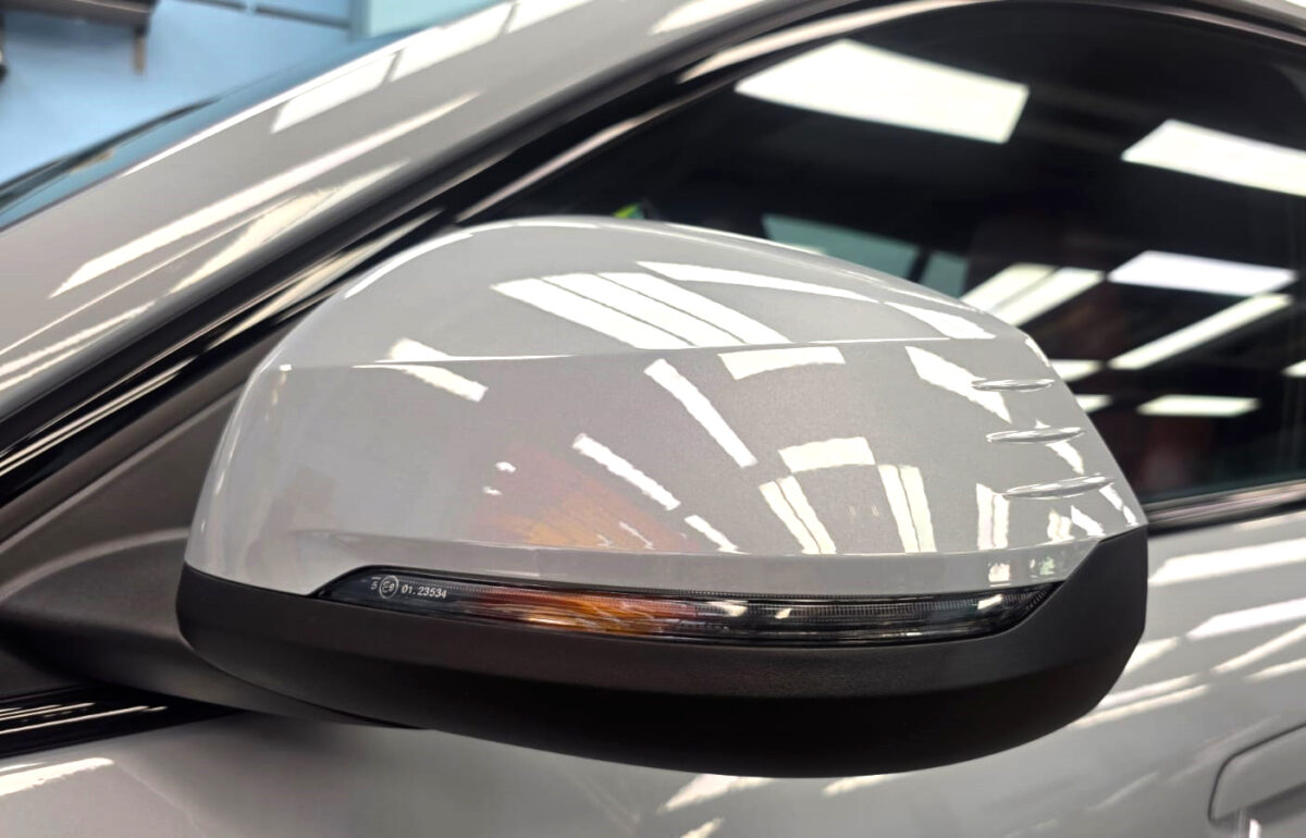 Side panel of the BMW iX2 with the titanium finish locked in.