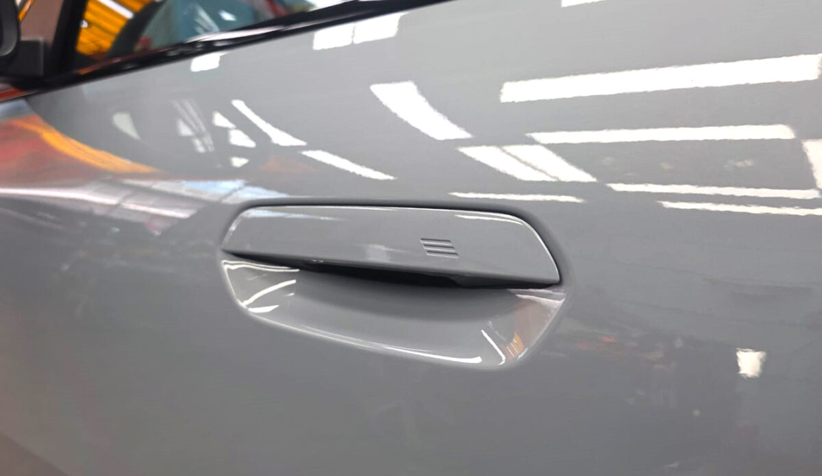 Rear quarter of the BMW iX2, glossy and protected.