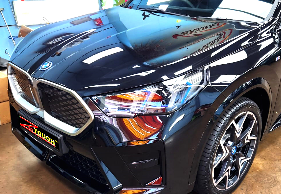 The BMW iX2 from a side angle after the titanium coating.