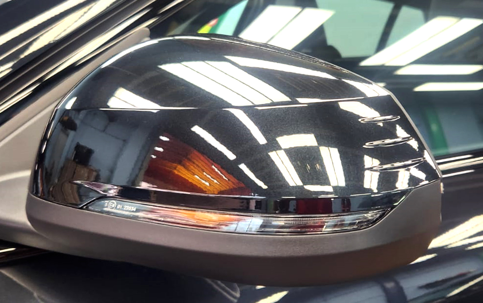 Side panel of the BMW iX2 with the titanium finish locked in.