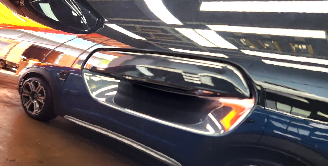 Front three-quarter view of the BMW iX2 after coating.