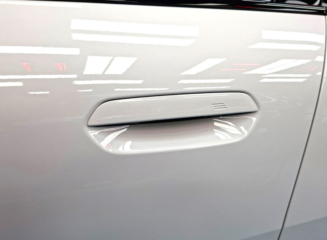 The coated paintwork of the BMW iX2, clean and sharp.