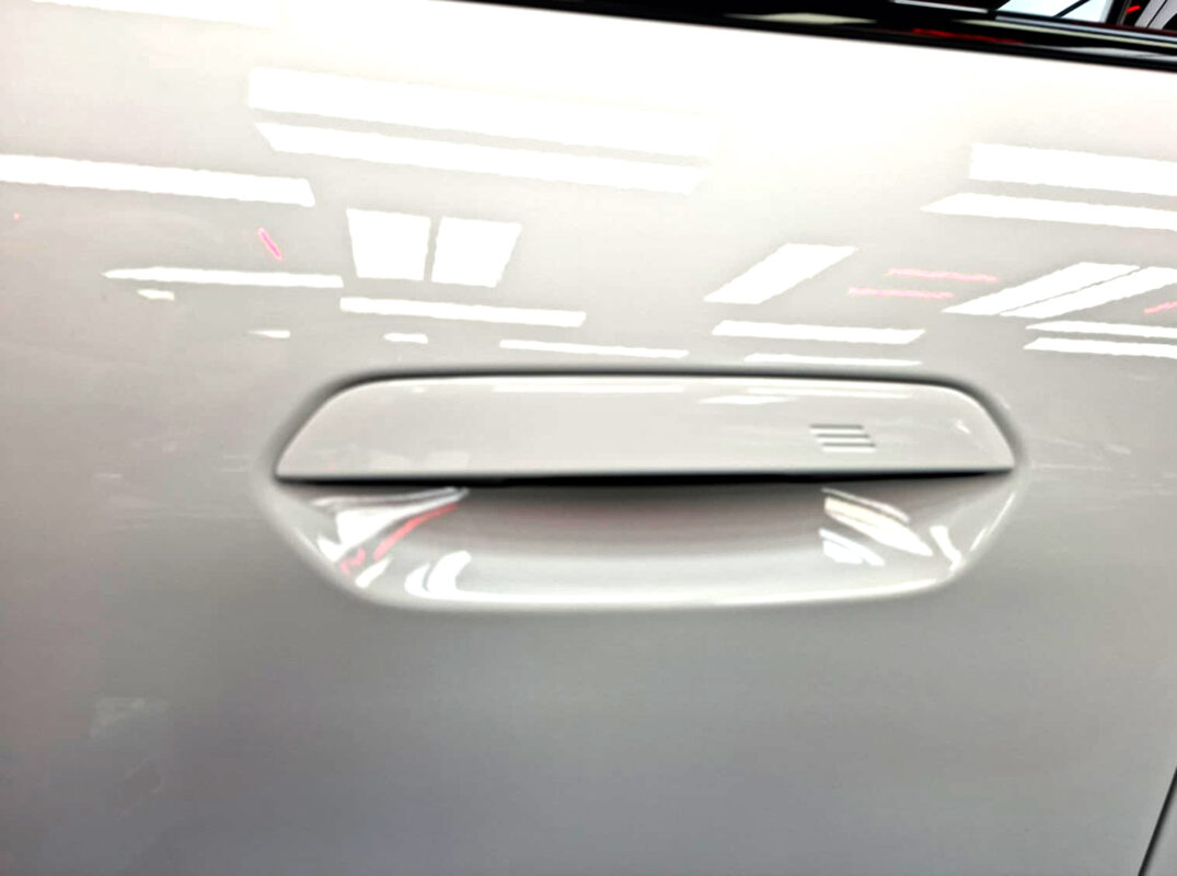 The coated paintwork of the BMW iX2, clean and sharp.