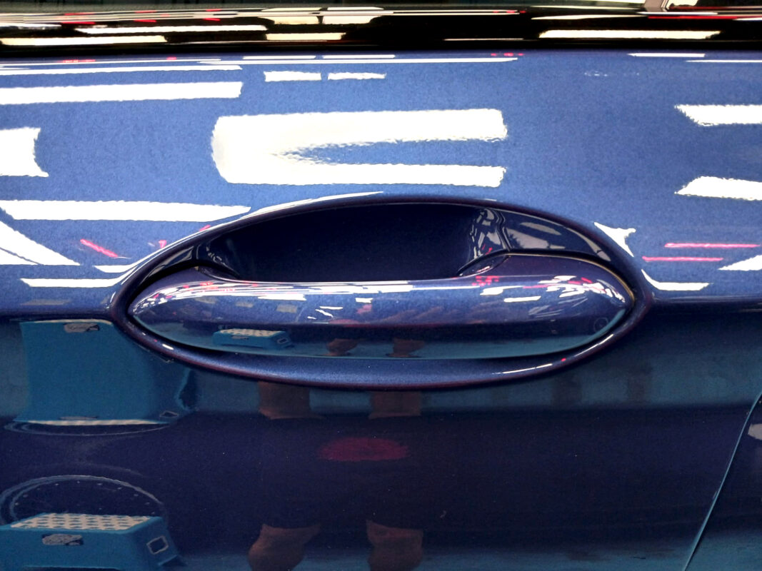 Front three-quarter view of the BMW iX3 after coating.