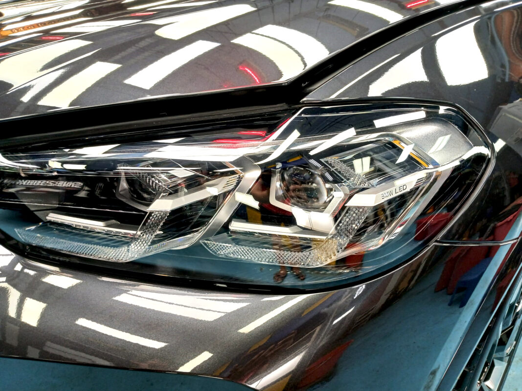 The iX3's coated paintwork showing clean reflections.