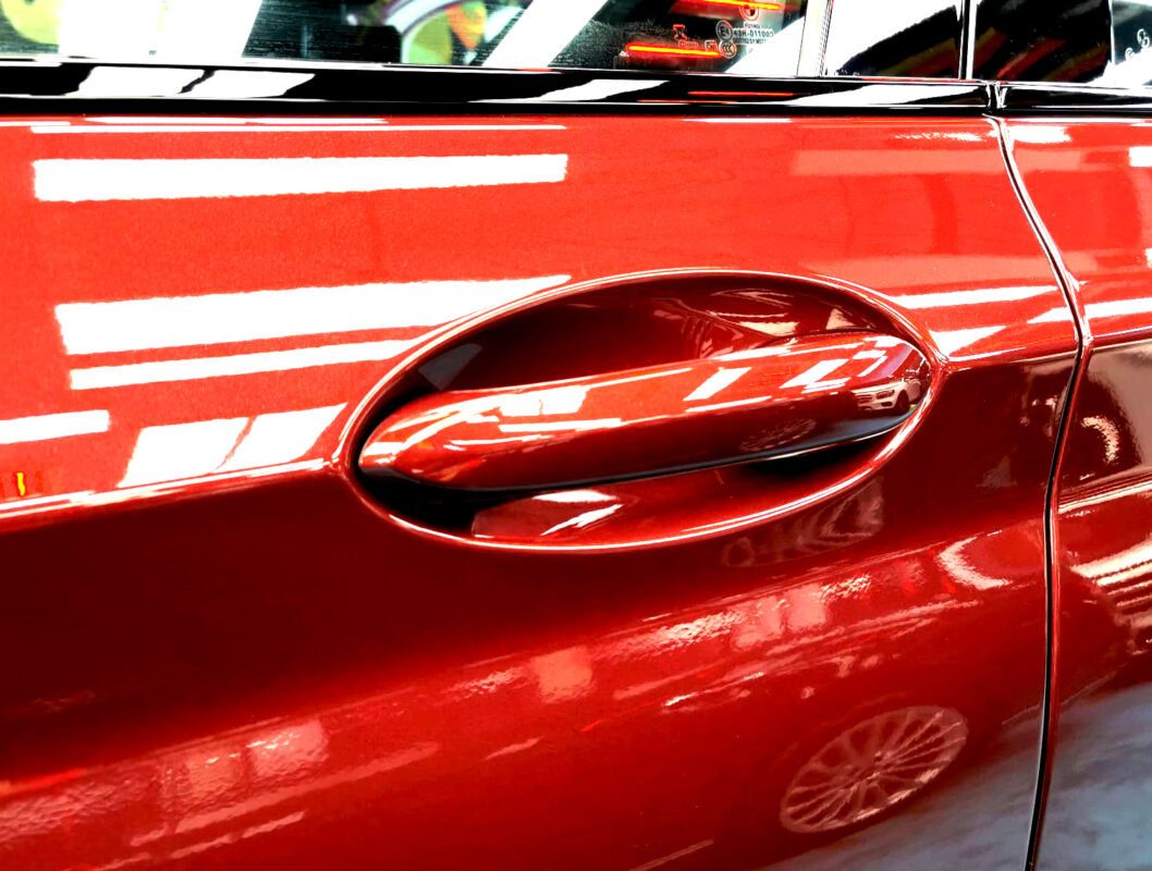 The coated paintwork of the BMW iX3, clean and sharp.