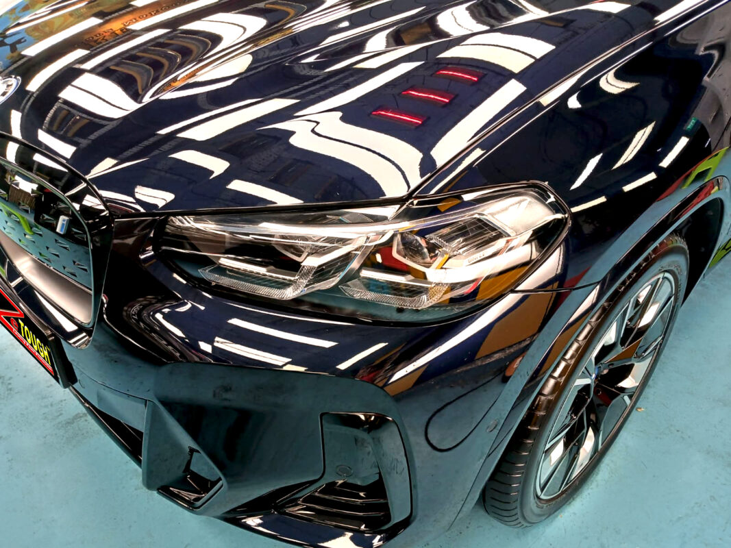 The BMW iX3 from a side angle after the ceramic coating.