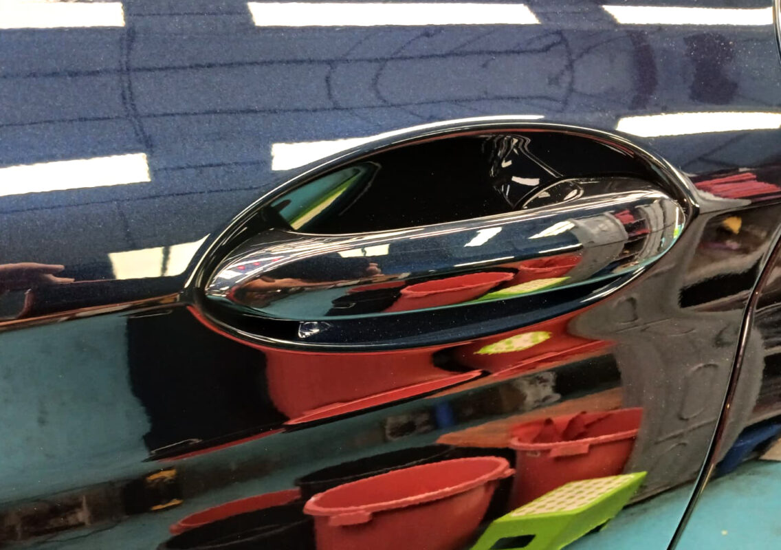 Side panel of the BMW iX3 with the ceramic finish locked in.
