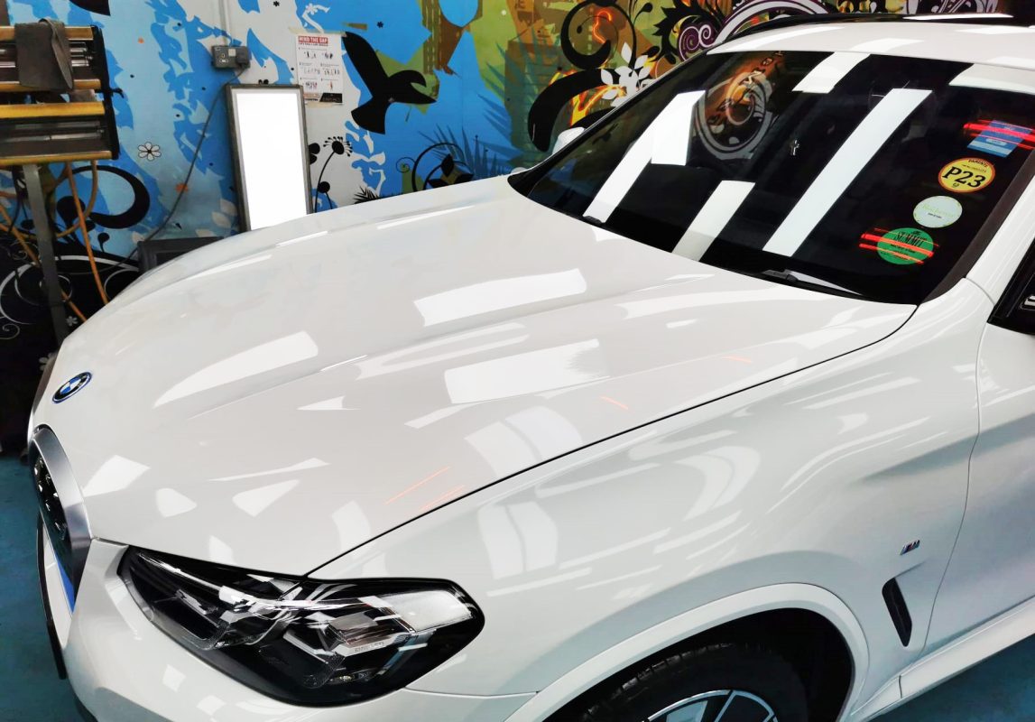 The BMW iX3 from a side angle after the titanium coating.
