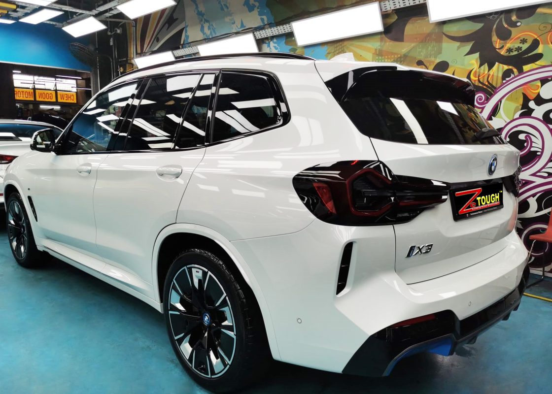 Rear quarter of the BMW iX3, glossy and protected.