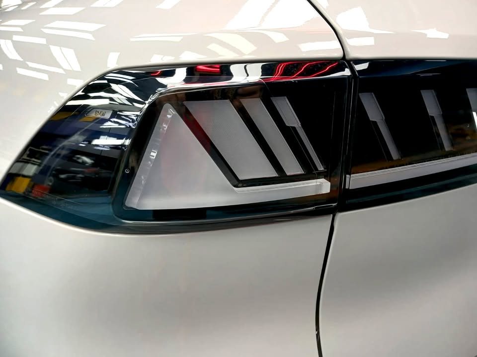 Close-up of the iX3 tail lamp and rear quarter.