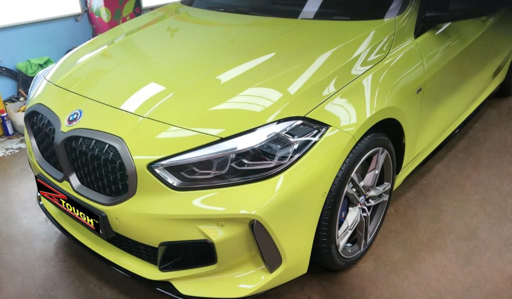 The BMW M135i from a side angle after the ceramic coating.