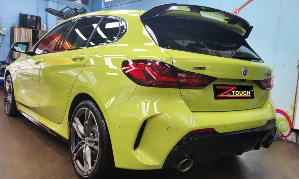 Rear quarter of the BMW M135i, glossy and protected.