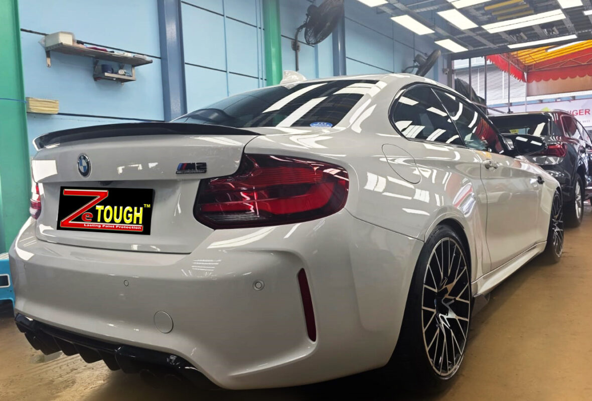 Rear quarter of the BMW M2, glossy and protected.