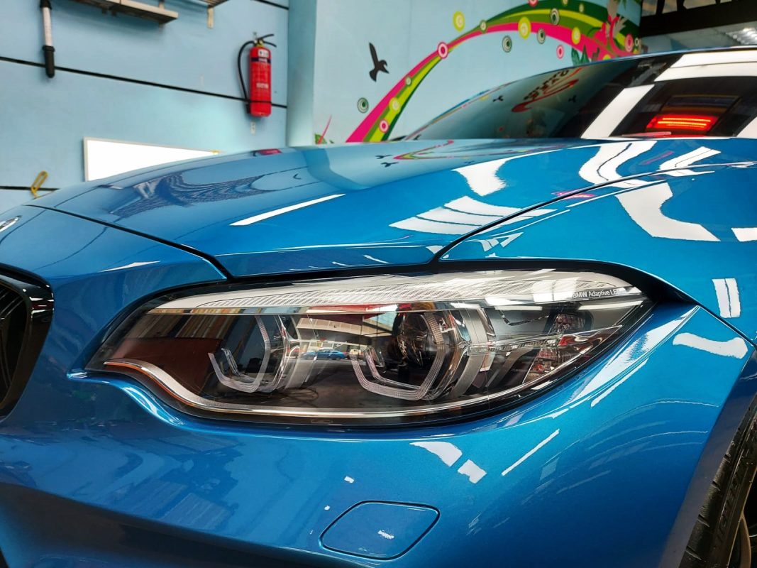 The M2's coated paintwork showing clean reflections.