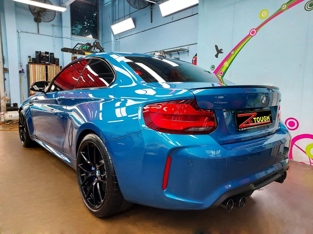 Rear quarter of the BMW M2, glossy and protected.