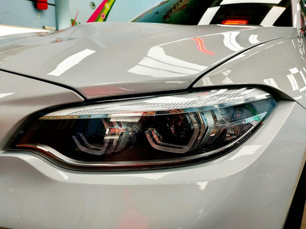 The M2's coated paintwork showing clean reflections.
