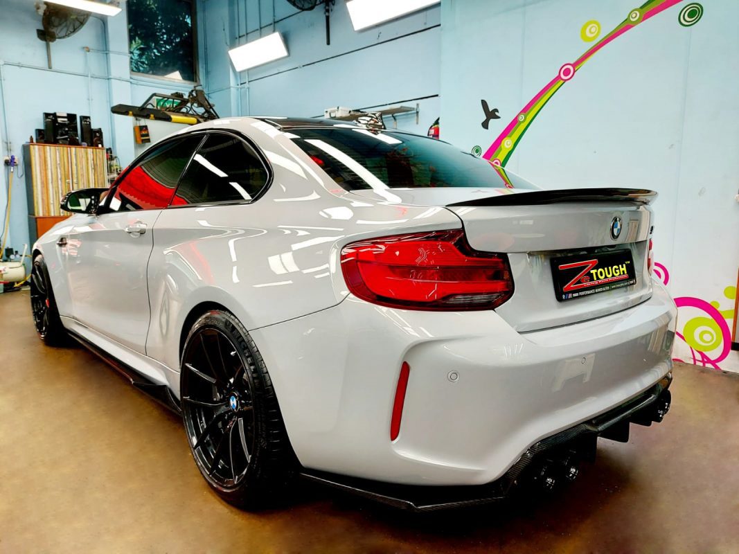 Rear quarter of the BMW M2, glossy and protected.