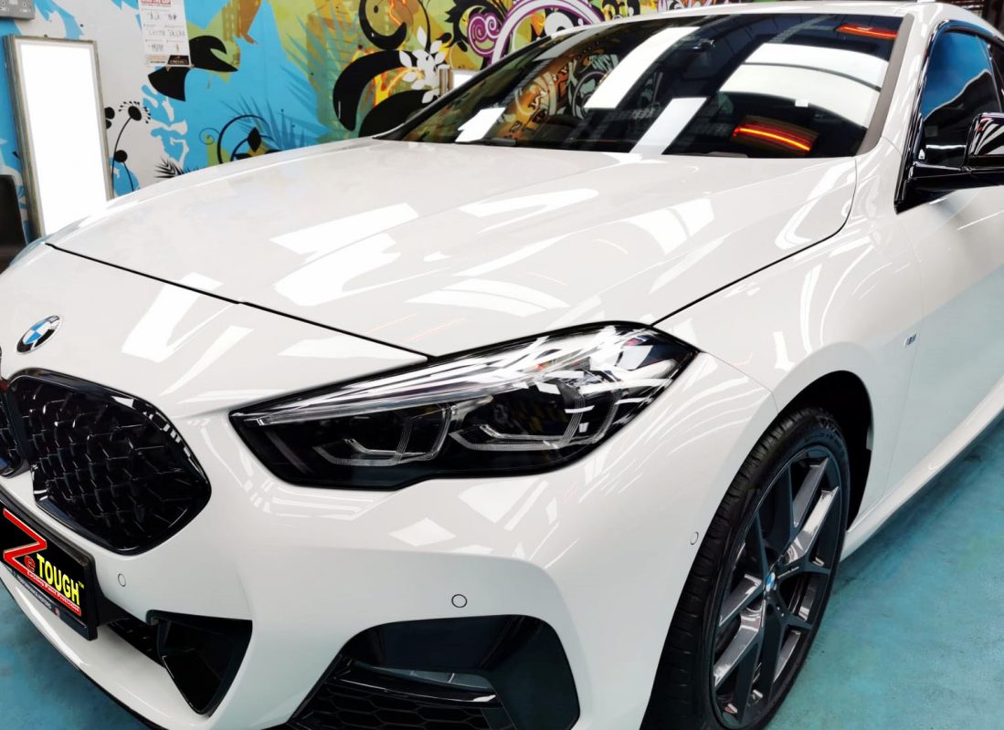 The BMW M235i from a side angle after the ceramic coating.