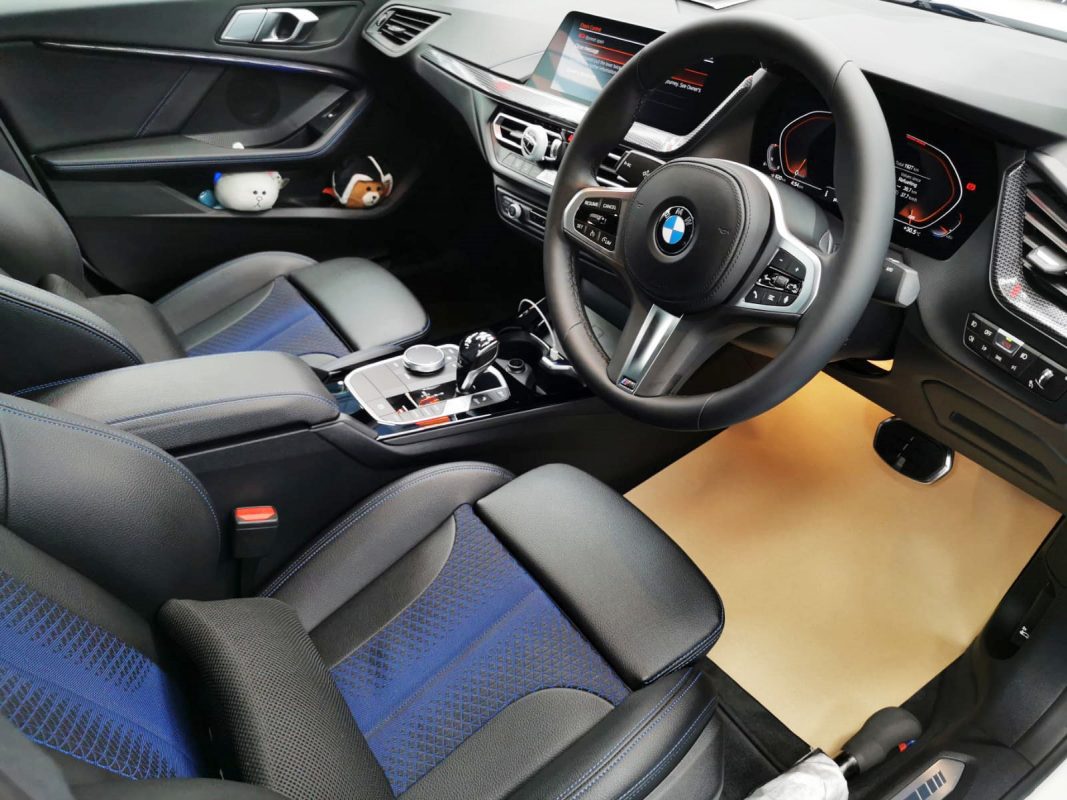 The BMW M235i parked in the workshop, freshly coated.